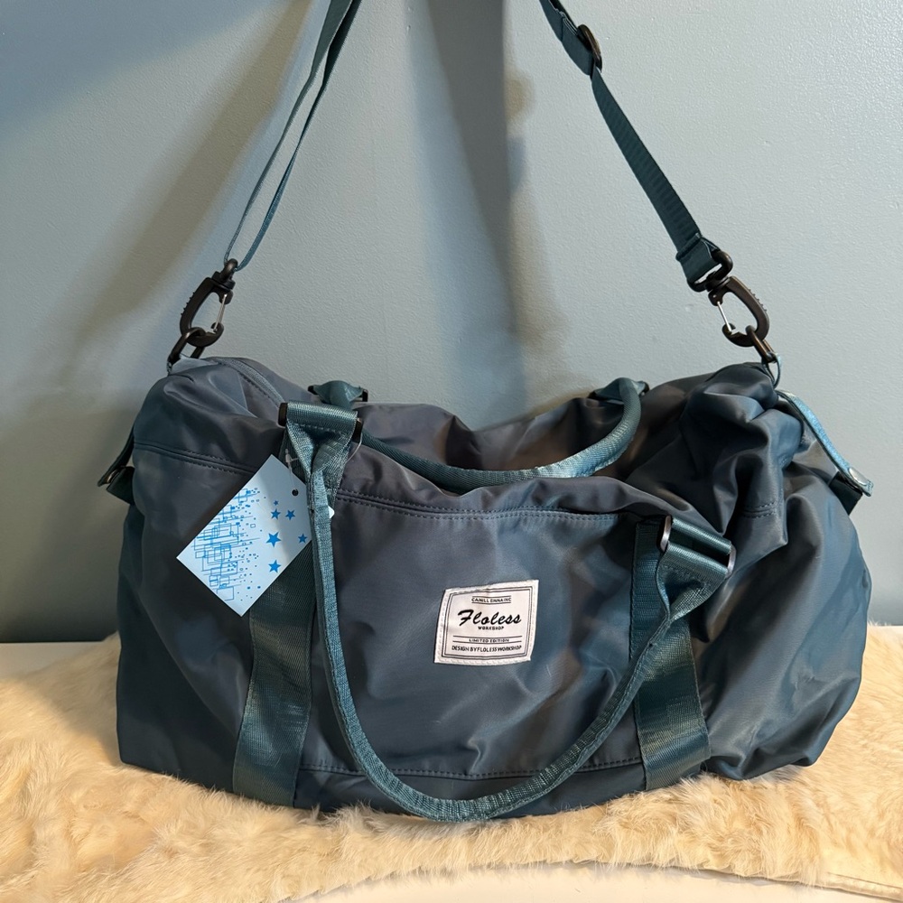 Floless Workshop Sky Blue Duffle Bag by Camill Emma